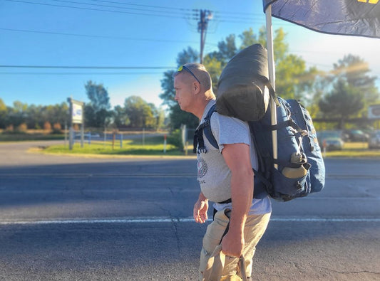 John Mumby walking across texas wearing a squatch survival gear Rockape pack - made in america - near the finish line in El Paso - Fort Bliss