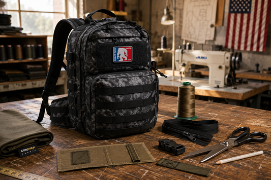 American-made outdoor backpack on a sewing workbench showing premium materials, hardware, and construction used in quality outdoor gear manufacturing.