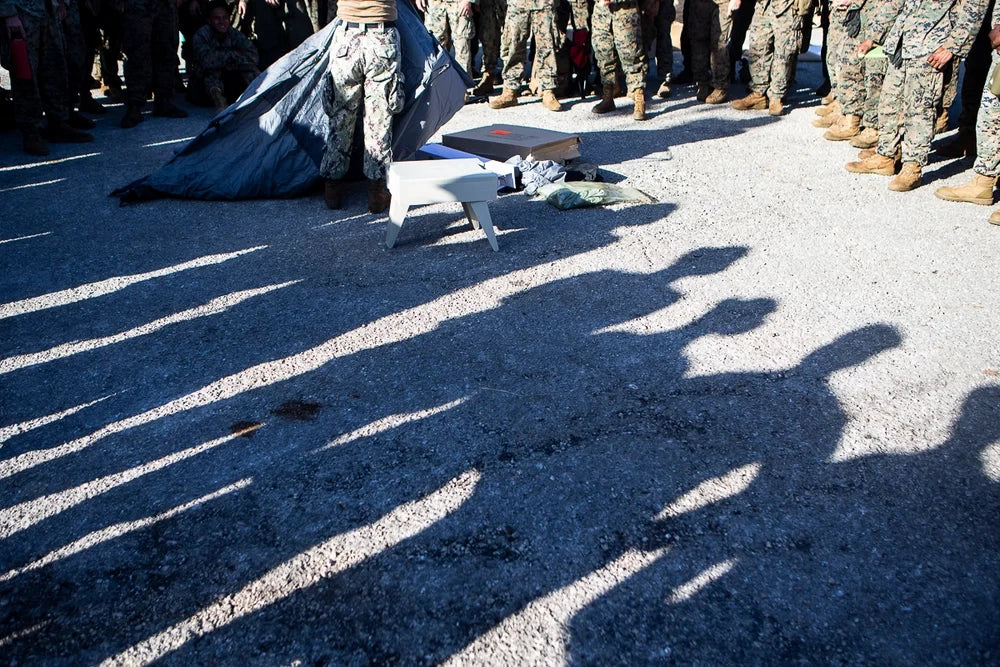 U.S. Navy Seabee assembles a FEMA-provided portable toilet during disaster-relief operations on Tinian after Super Typhoon Yutu.