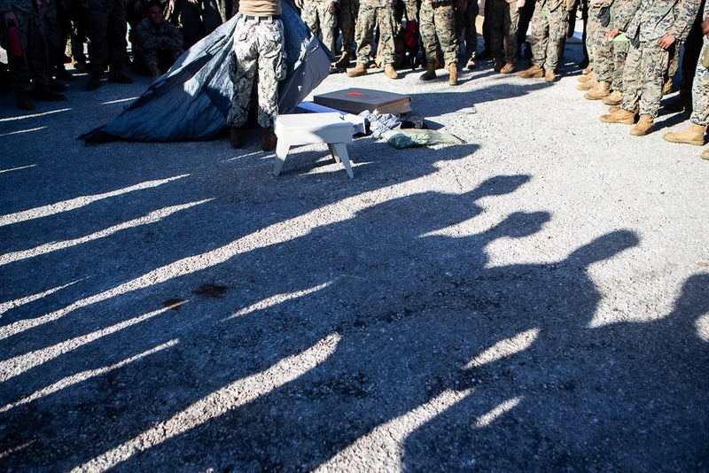 U.S. Navy Seabee assembles a FEMA-provided portable toilet during disaster-relief operations on Tinian after Super Typhoon Yutu.
