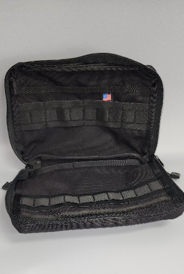 Open view of Squatch Survival Gear black admin pouch displaying multiple internal pockets and compartments for organizing tools, documents, and small gear, ideal for tactical missions and survival scenarios